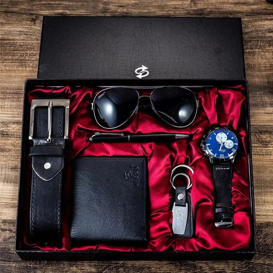 A black 6-piece men's gift set displayed in a red satin-lined box, including a watch, sunglasses, belt, wallet, key holder, and pen.